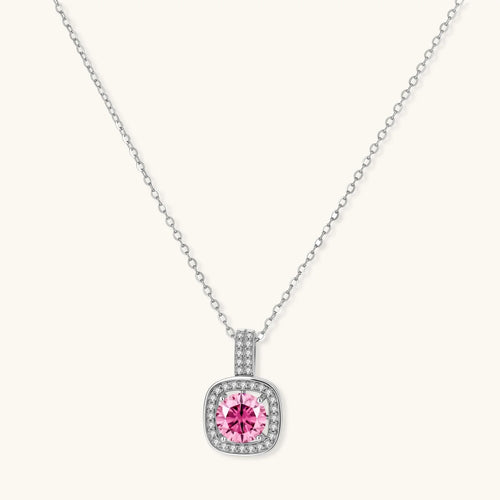 Sterling silver necklace with cushion-cut pink moissanite in diamond halo setting on white background