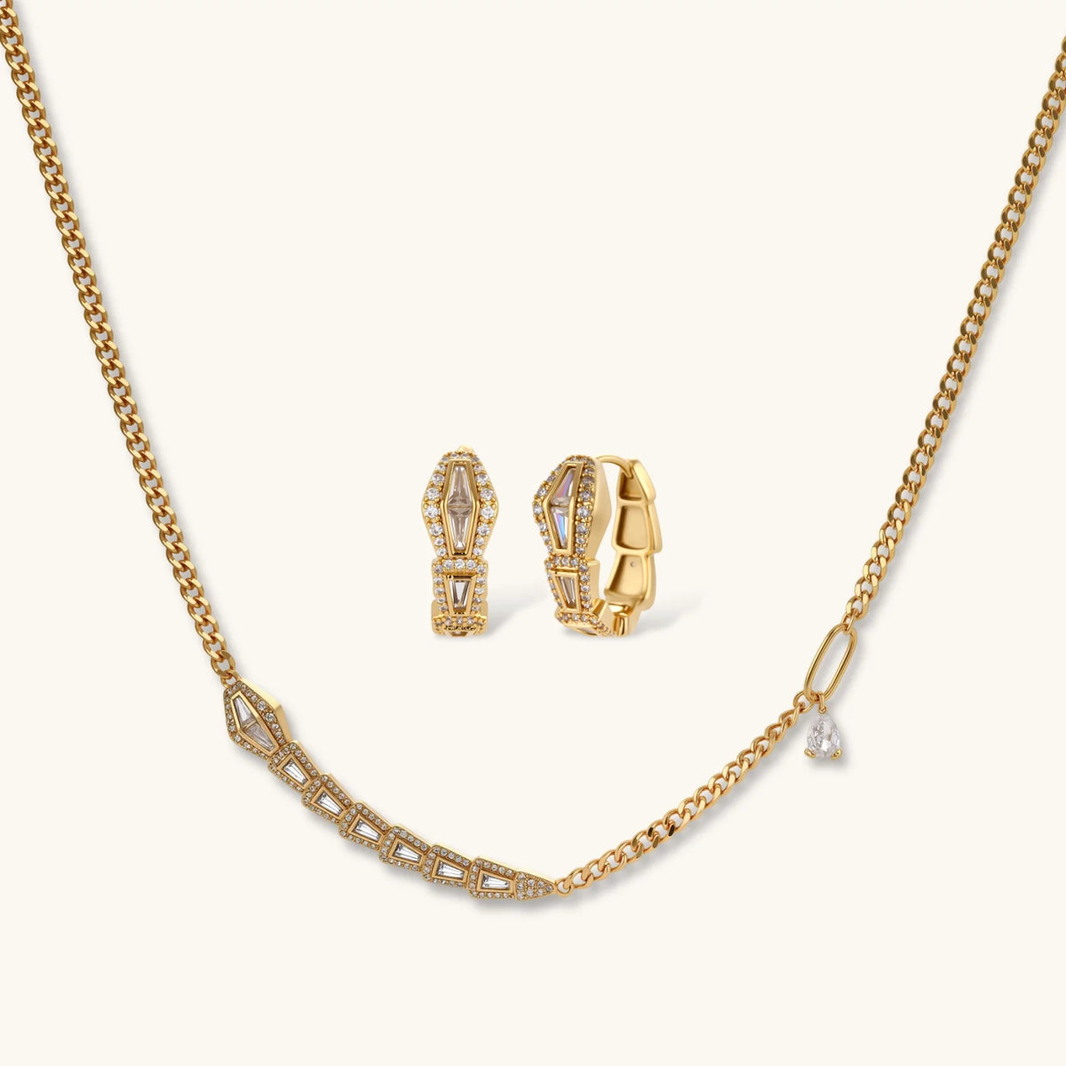 Gold-plated necklace with geometric diamond segments and matching huggie earrings featuring cubic zirconia details