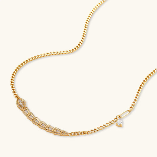 Gold-plated necklace with geometric diamond segments and matching huggie earrings featuring cubic zirconia details