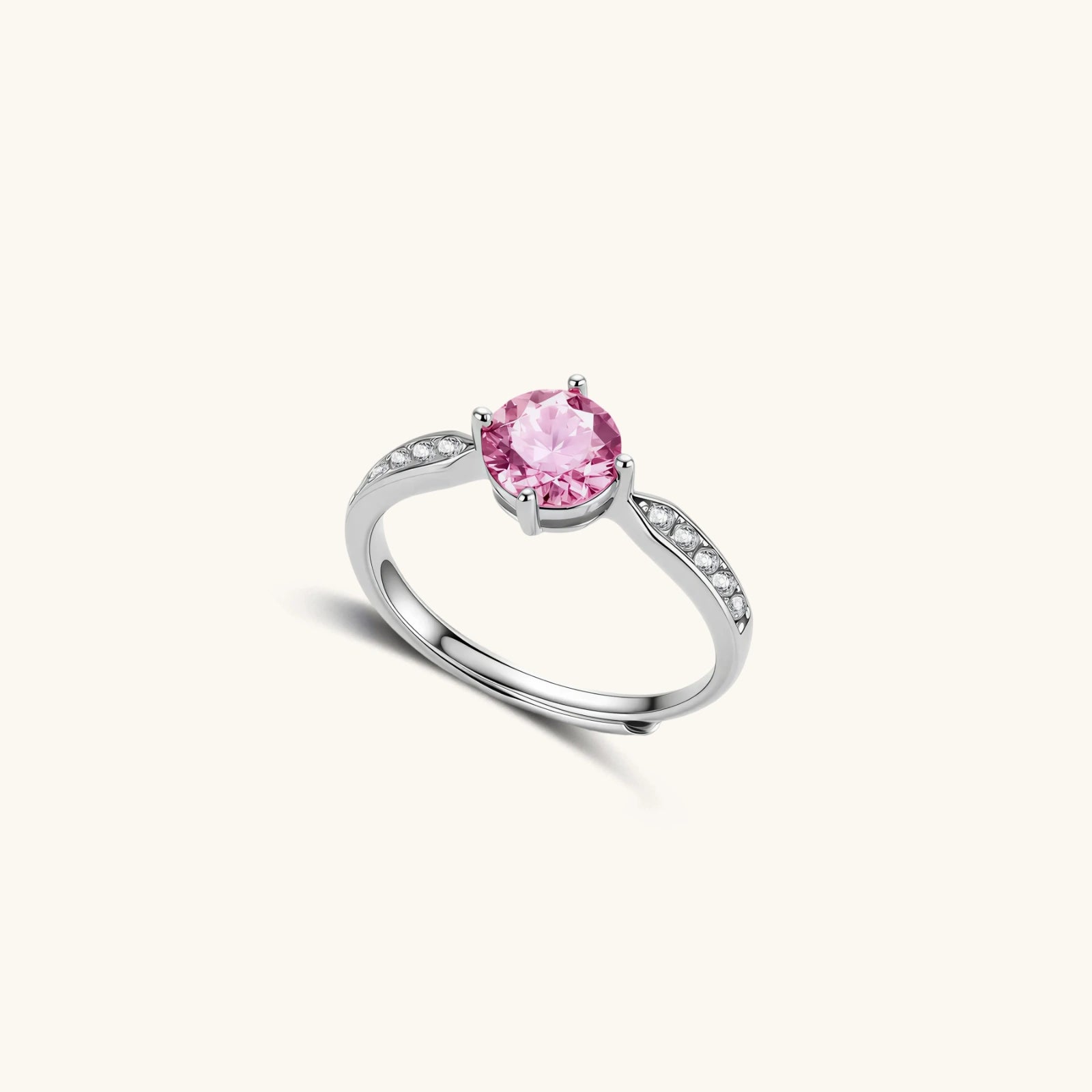 Brilliant pink moissanite ring in sterling silver 4-prong setting with accent stones on adjustable band