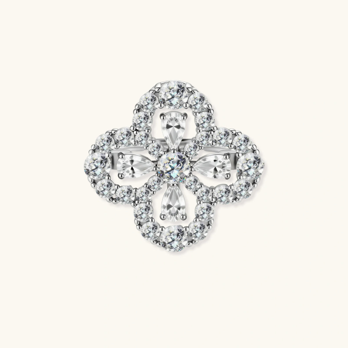 Adjustable sterling silver ring with quatrefoil design featuring brilliant moissanite stones in clover pattern