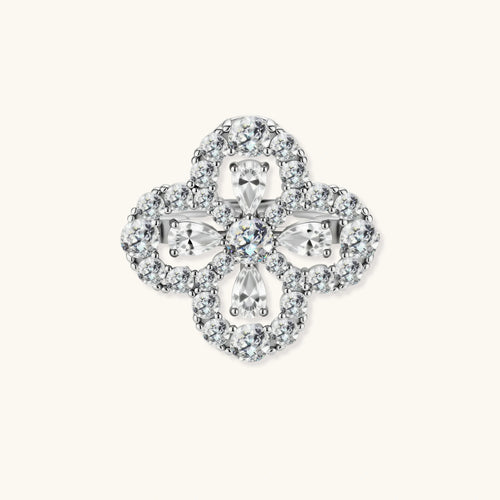 Adjustable sterling silver ring with quatrefoil design featuring brilliant moissanite stones in clover pattern