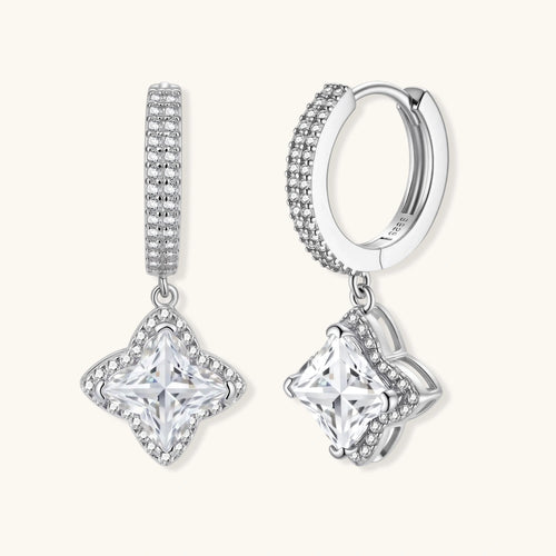 Sterling silver huggie hoops with geometric diamond-shaped moissanite dangles featuring pavé crystal details
