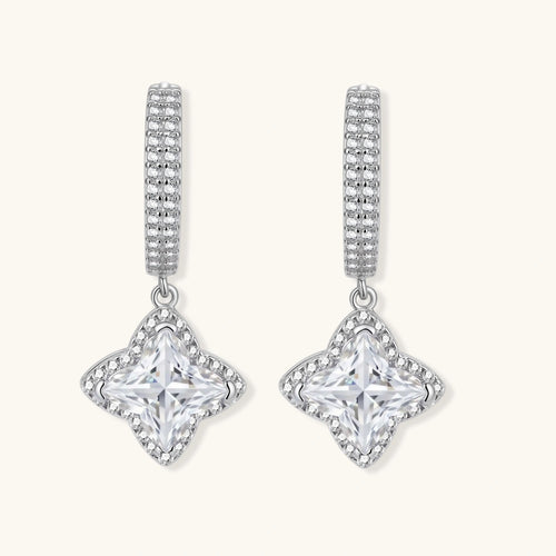 Sterling silver huggie hoops with geometric diamond-shaped moissanite dangles featuring pavé crystal details