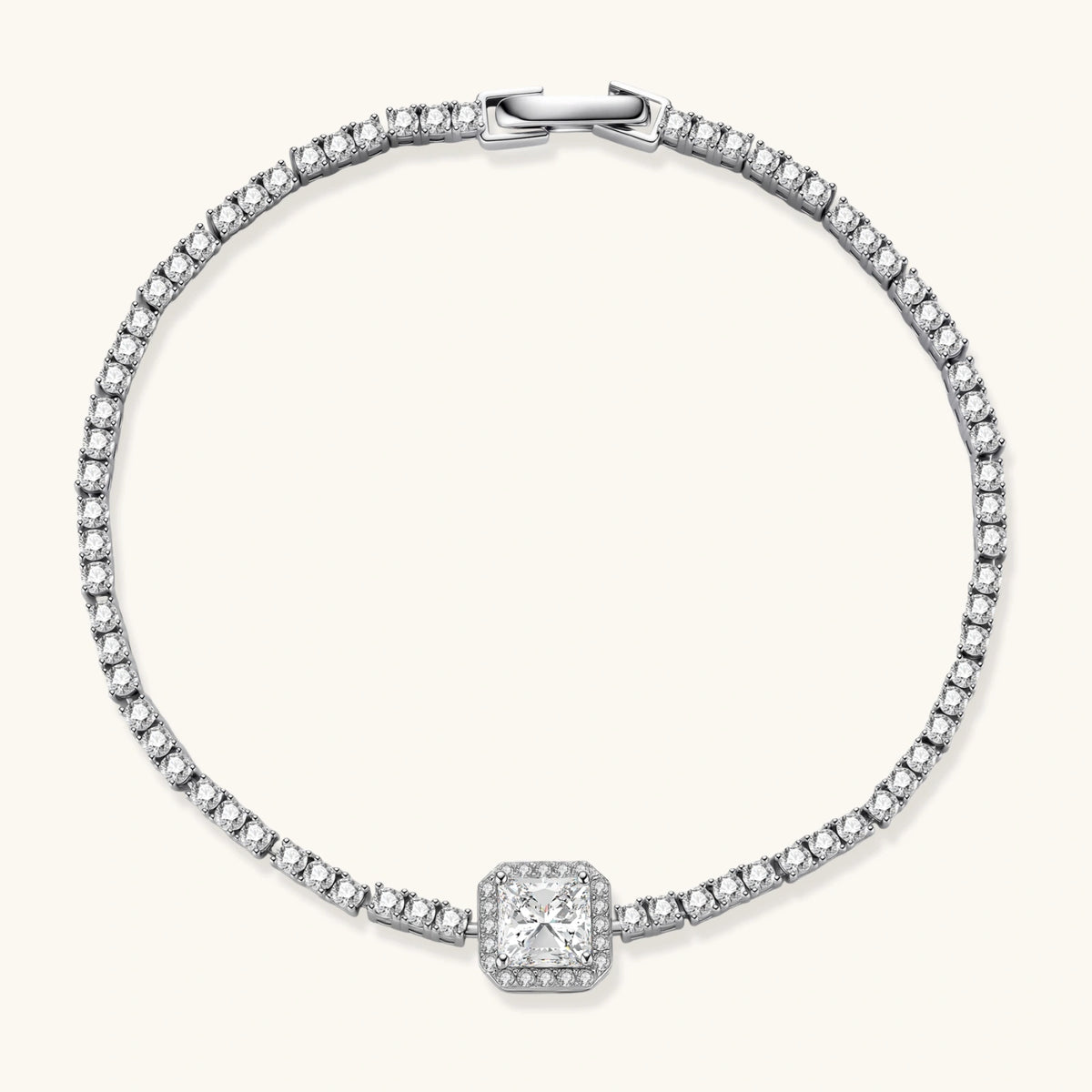 Sterling silver tennis bracelet with cushion-cut moissanite centerpiece surrounded by smaller stones in continuous setting