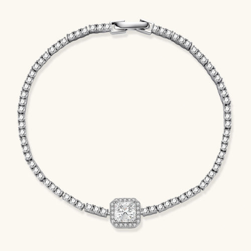 Sterling silver tennis bracelet with cushion-cut moissanite centerpiece surrounded by smaller stones in continuous setting