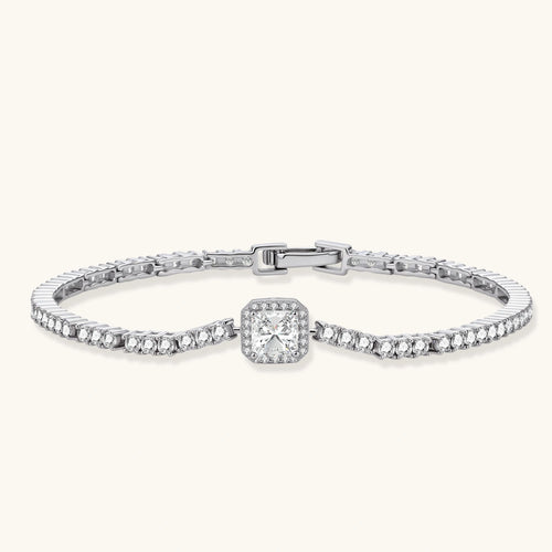 Sterling silver tennis bracelet with cushion-cut moissanite centerpiece surrounded by smaller stones in continuous setting