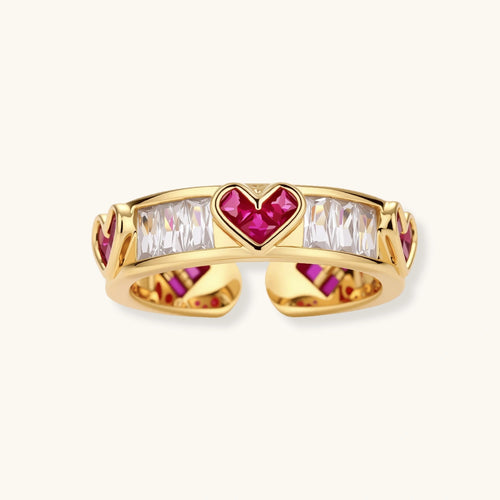 Gold-plated adjustable ring with alternating red heart-shaped and clear rectangular zirconia stones in geometric pattern
