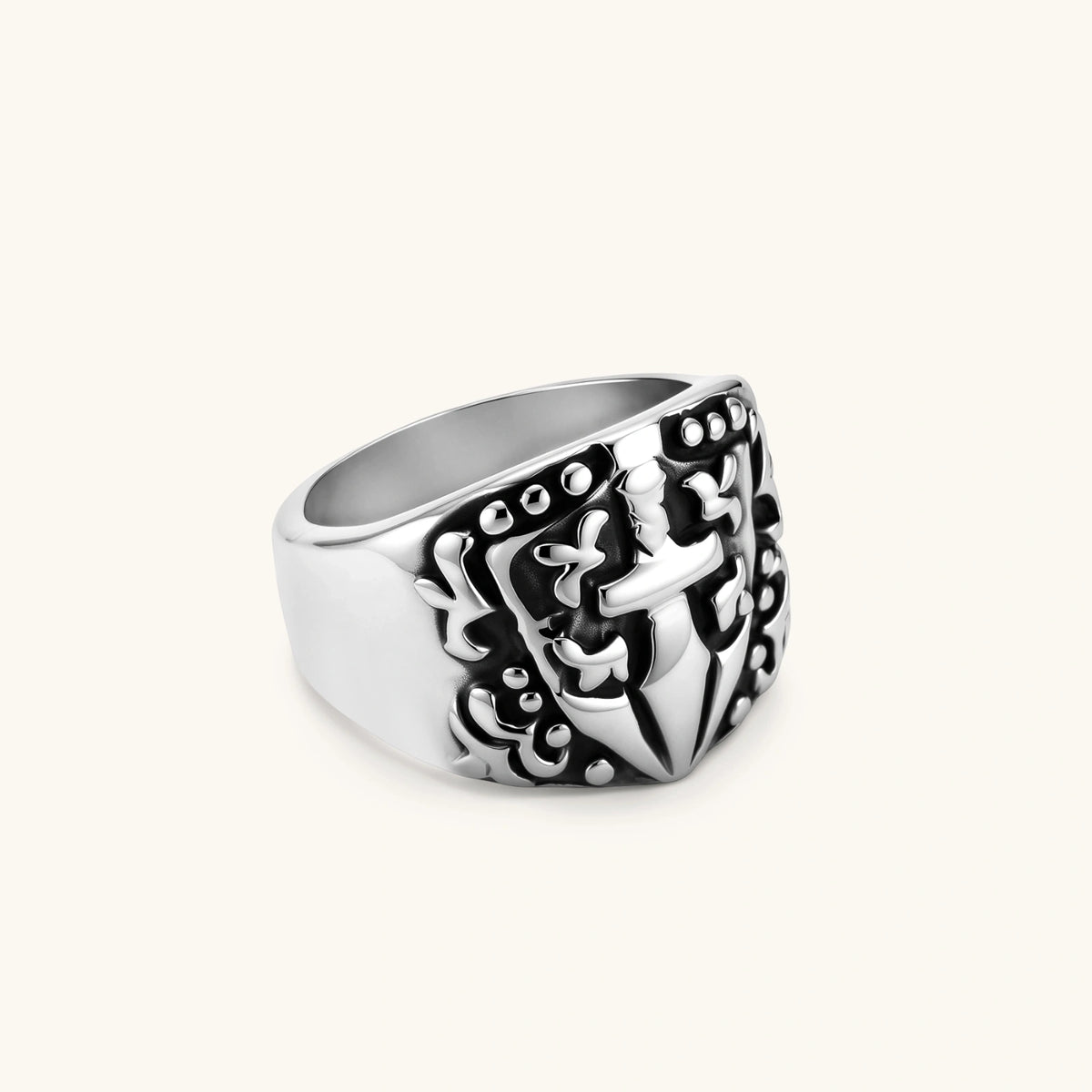 Silver 316L stainless steel men's signet ring with raised knight shield, cross motif, and ornate blackened scrollwork detailing.