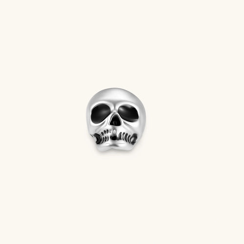 Matte silver skull stud earring with black enamel eye sockets and detailed teeth, post backing, 316L stainless steel.