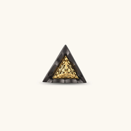 Single triangle stud earring with dark gunmetal outer frame and raised 18K gold-plated ornamental center, post back.