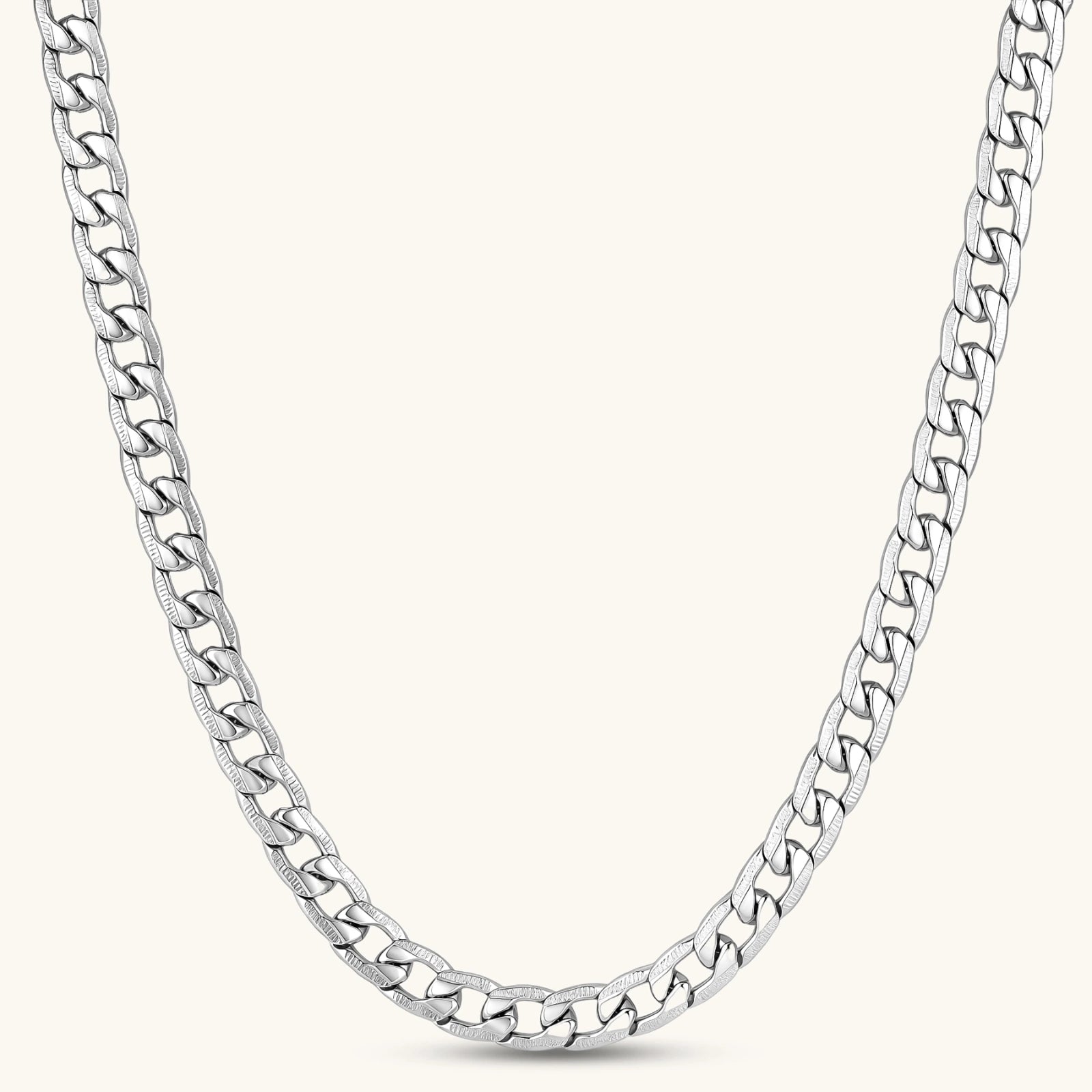 Silver 316L stainless steel carved curb chain necklace with lobster clasp and extender, 7.2mm wide, on cream background.
