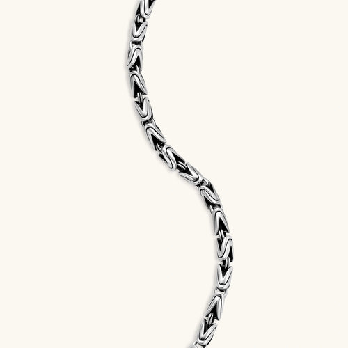 Men's antique silver Byzantine chain necklace, 6.2mm wide interlocking S-link pattern with ornate lobster clasp, 560mm length.