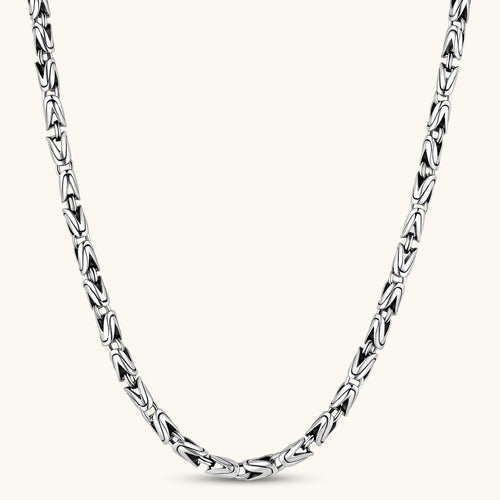 Men's antique silver Byzantine chain necklace, 6.2mm wide interlocking S-link pattern with ornate lobster clasp, 560mm length.