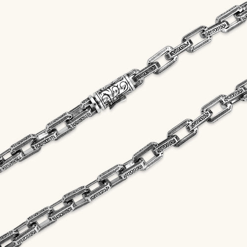 Silver 316L stainless steel rectangular link chain necklace with intricate scroll engravings, 560mm length, 7.1mm width.
