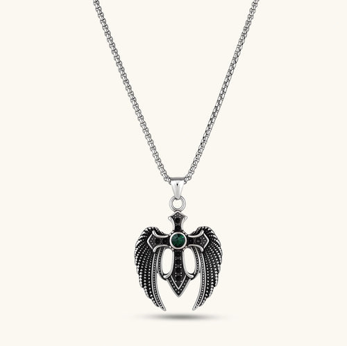 Silver stainless steel angel wing cross pendant necklace with green CZ center stone and black crystals on a box chain.