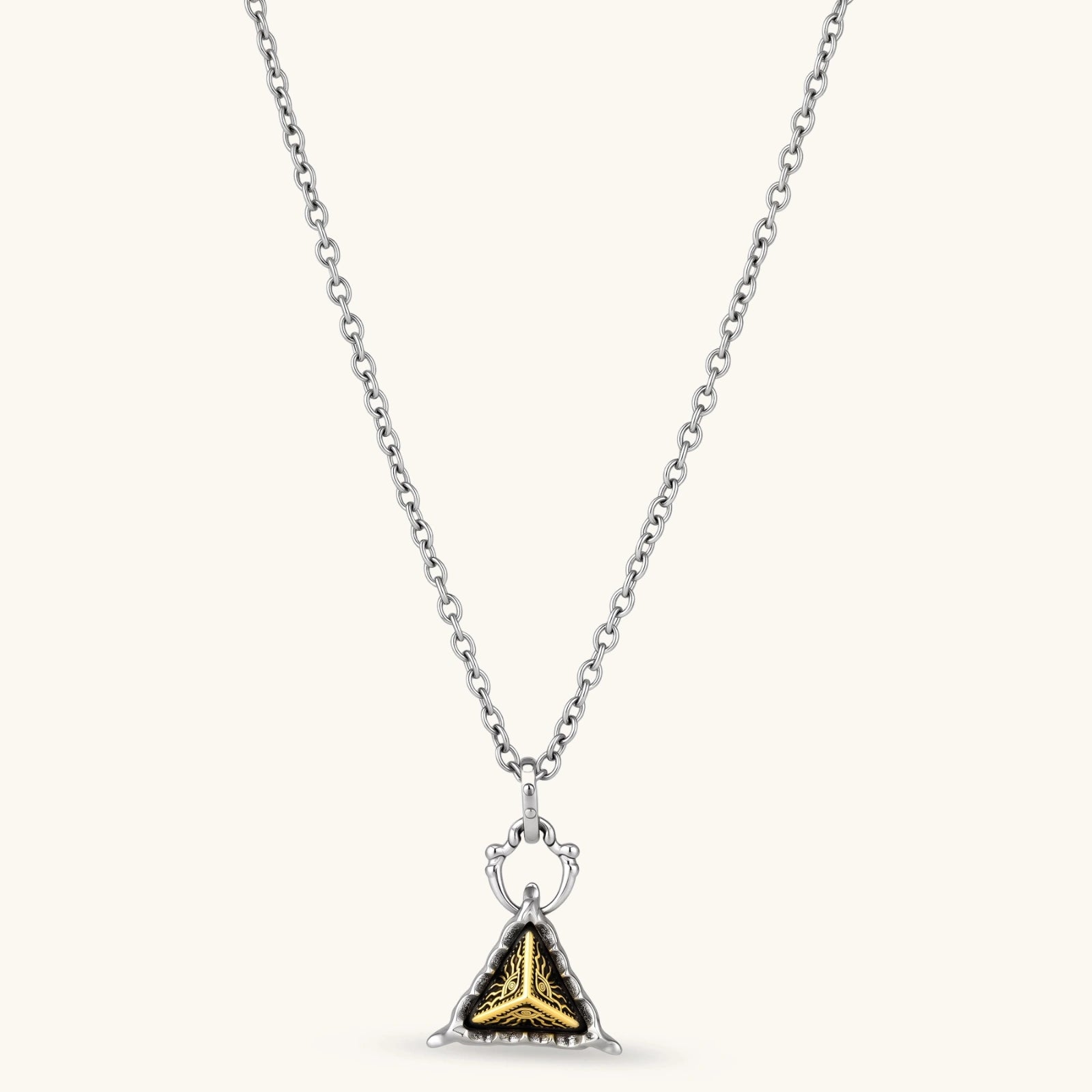 Silver cable-chain necklace with a black triangle pendant featuring gold all-seeing eye engraving and claw-tip frame, 316L stainless steel.