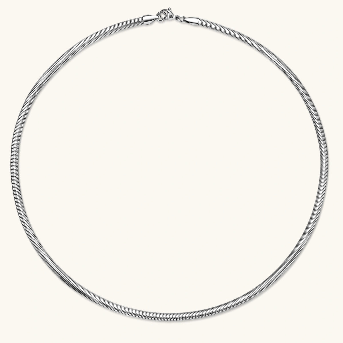 Two-tone twisted necklace with interlocked gold and silver ribbed snake chains, 6mm wide, on a white background.