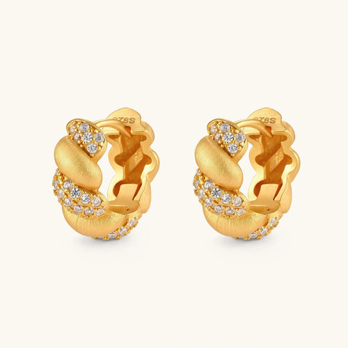 Pair of 18K gold-plated 925 silver huggie hoops with twisted braid texture and pavé cubic zirconia detailing, 15mm.