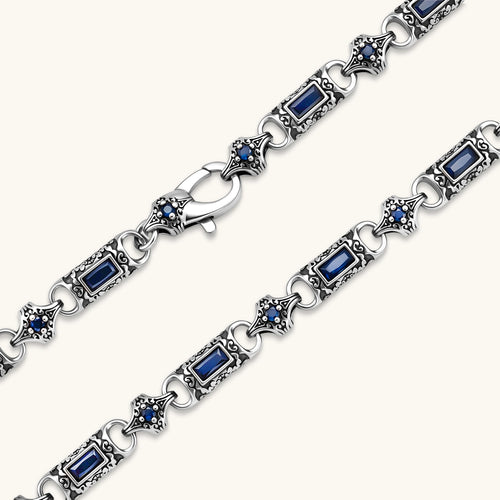 Oxidized silver 316L stainless steel chain necklace with rectangular navy CZ links and ornate gothic connector pieces, 640mm.