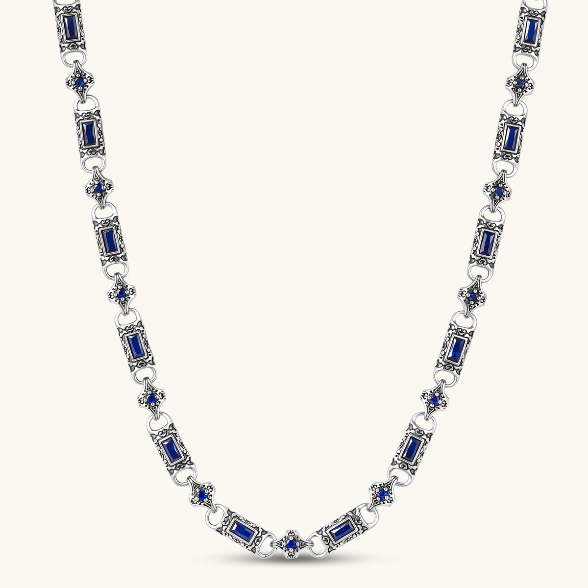 Oxidized silver 316L stainless steel chain necklace with rectangular navy CZ links and ornate gothic connector pieces, 640mm.