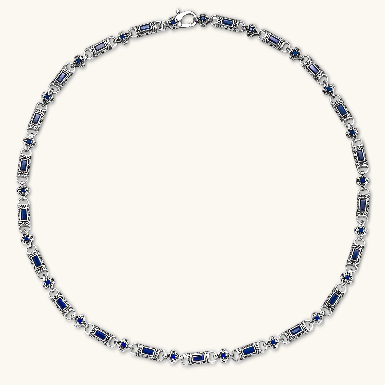 Oxidized silver 316L stainless steel chain necklace with rectangular navy CZ links and ornate gothic connector pieces, 640mm.